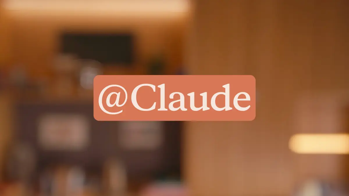 The @Claude tag label displayed in salmon and cream typography, representing Anthropic's new Claude Tag product for Slack