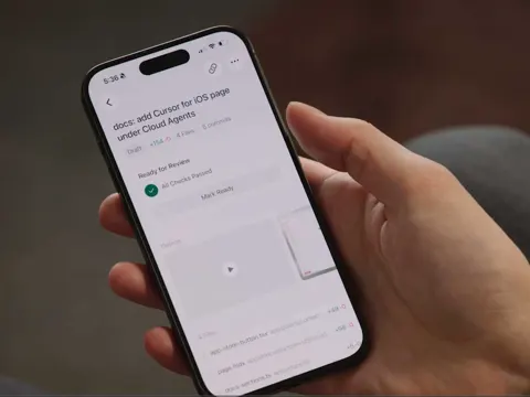 Cursor iOS app interface showing an AI agent running on a mobile phone