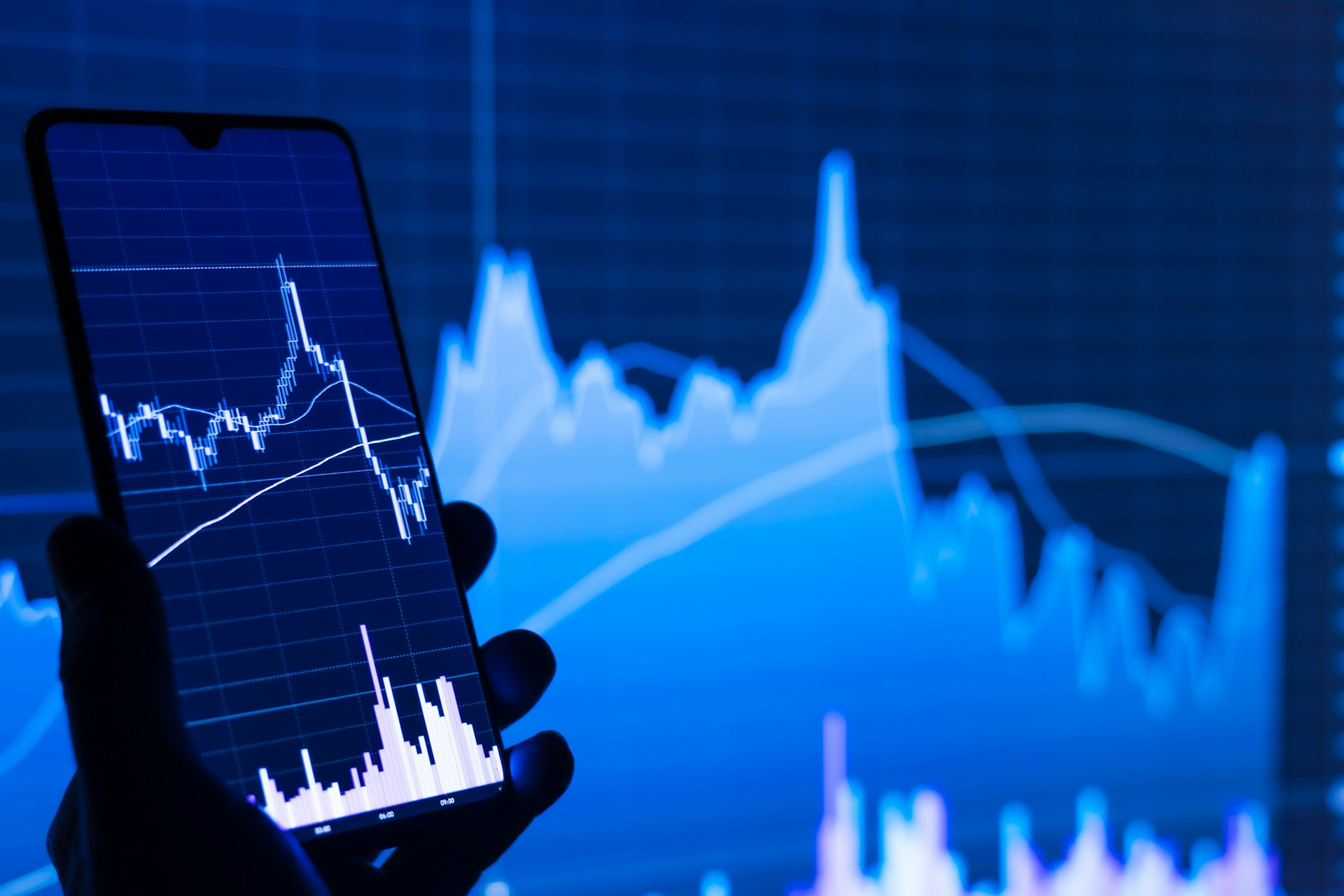 Financial trading screen displaying red declining stock market numbers and index data