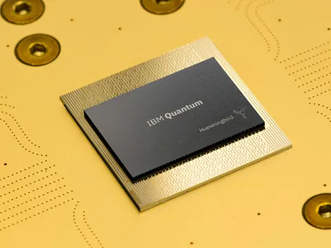 Close-up of a quantum computing processor with gold wiring and cryogenic hardware components in a research lab