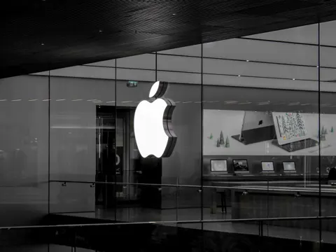 Apple Intelligence logo on a dark background representing the AI service receiving regulatory approval in China
