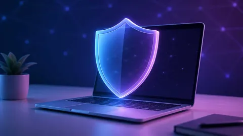 Illustration of a protective shield over a laptop representing free VPN privacy protection
