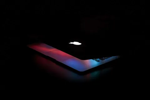Concept render of Apple's MacBook Ultra laptop showing a thin profile, OLED display, and Dynamic Island camera cutout replacing the notch