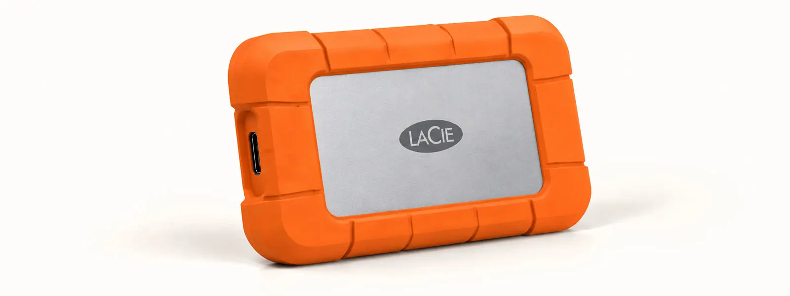 LaCie Rugged SSD4 portable solid-state drive with an orange protective bumper
